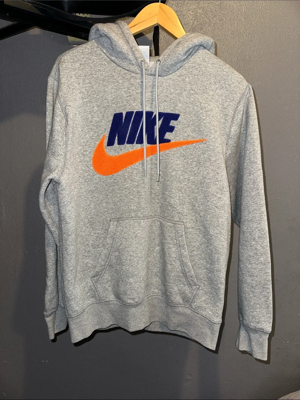 Nike Gray Hoodie with Blue Logo and Orange Swoosh Accent